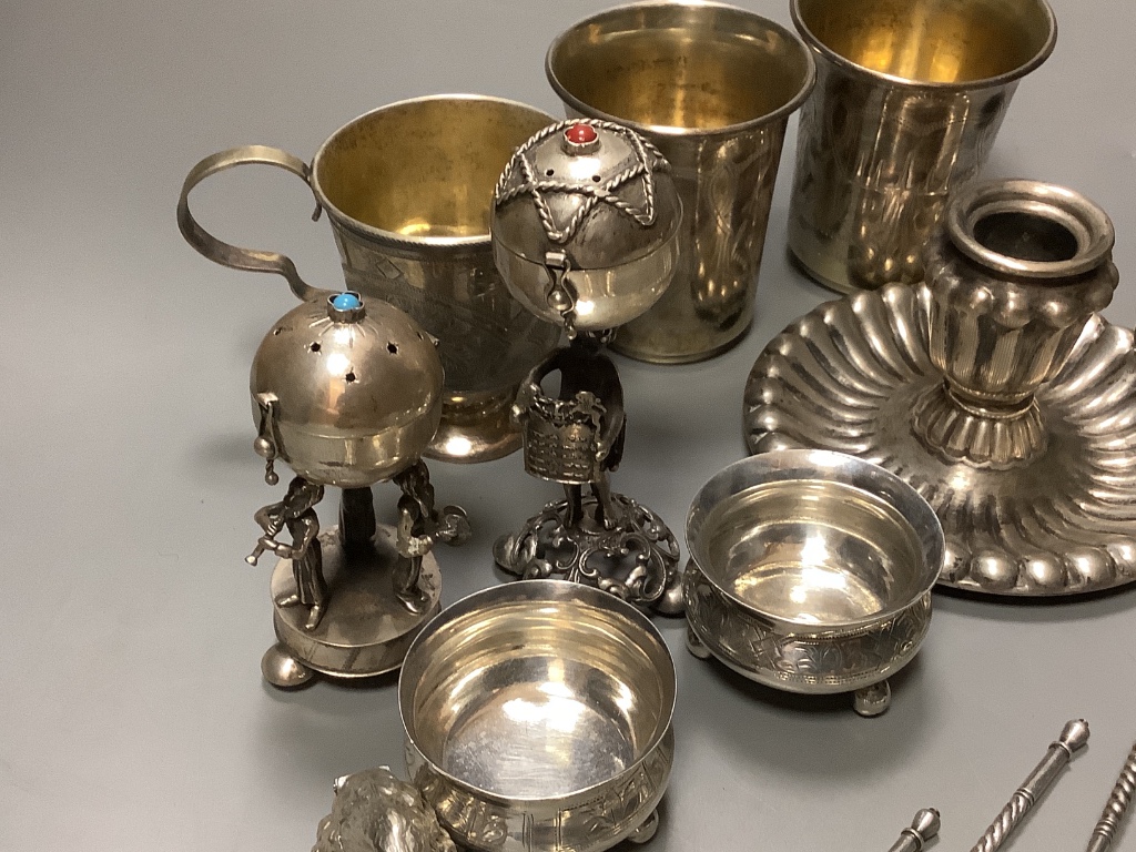 A late 19th century Russian gilt 84 zolotnik tea cup and saucer, dated 1883, a pair of similar salts and a group of other items.